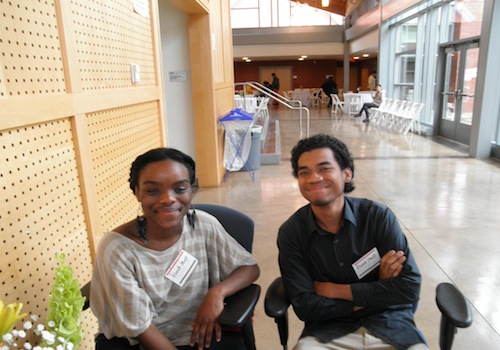 Student workers Olivia and Rizky smile for the camera.
